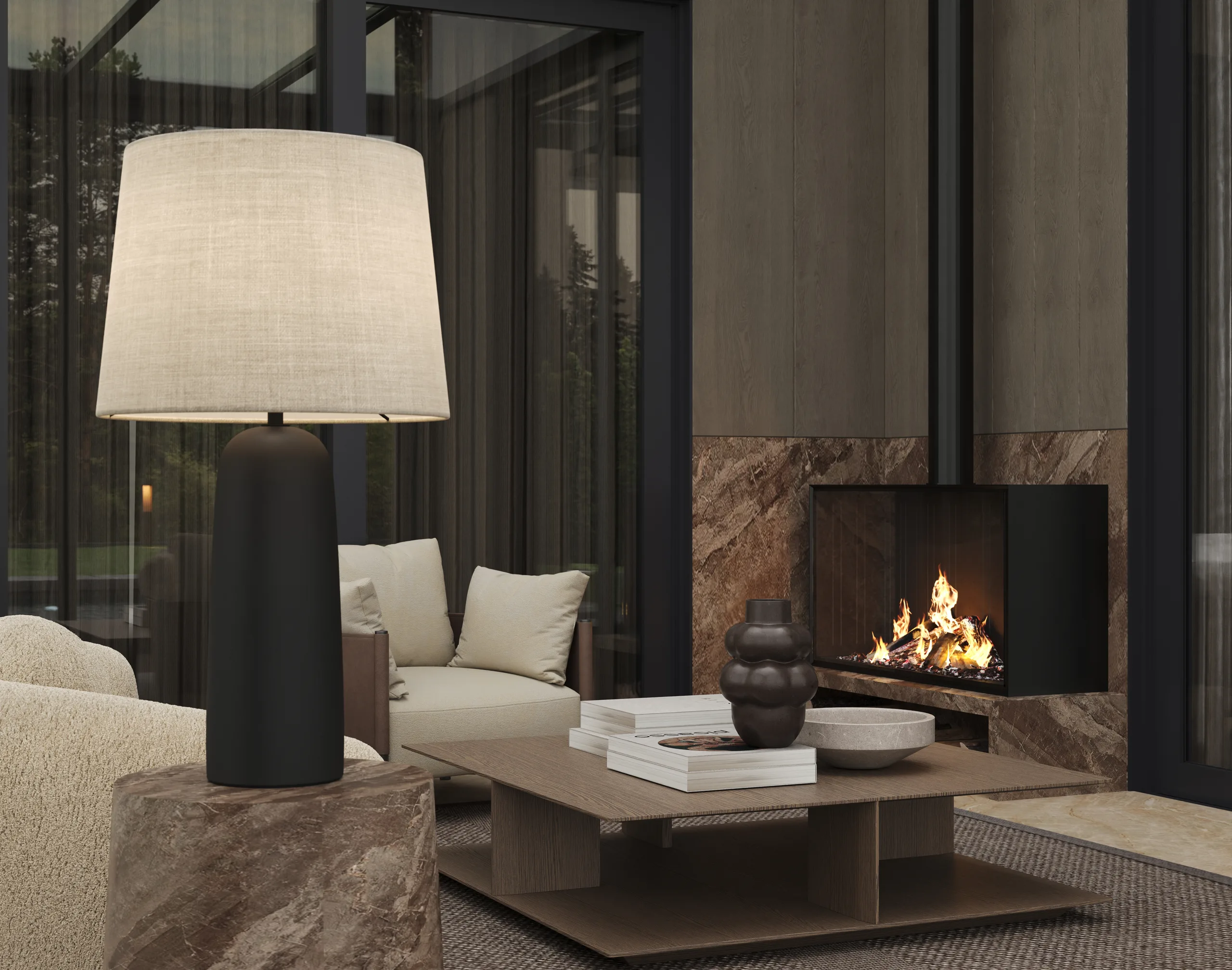 Close view of a winter garden lounge with a marble fireplace, a linen table lamp and a low bronze table.