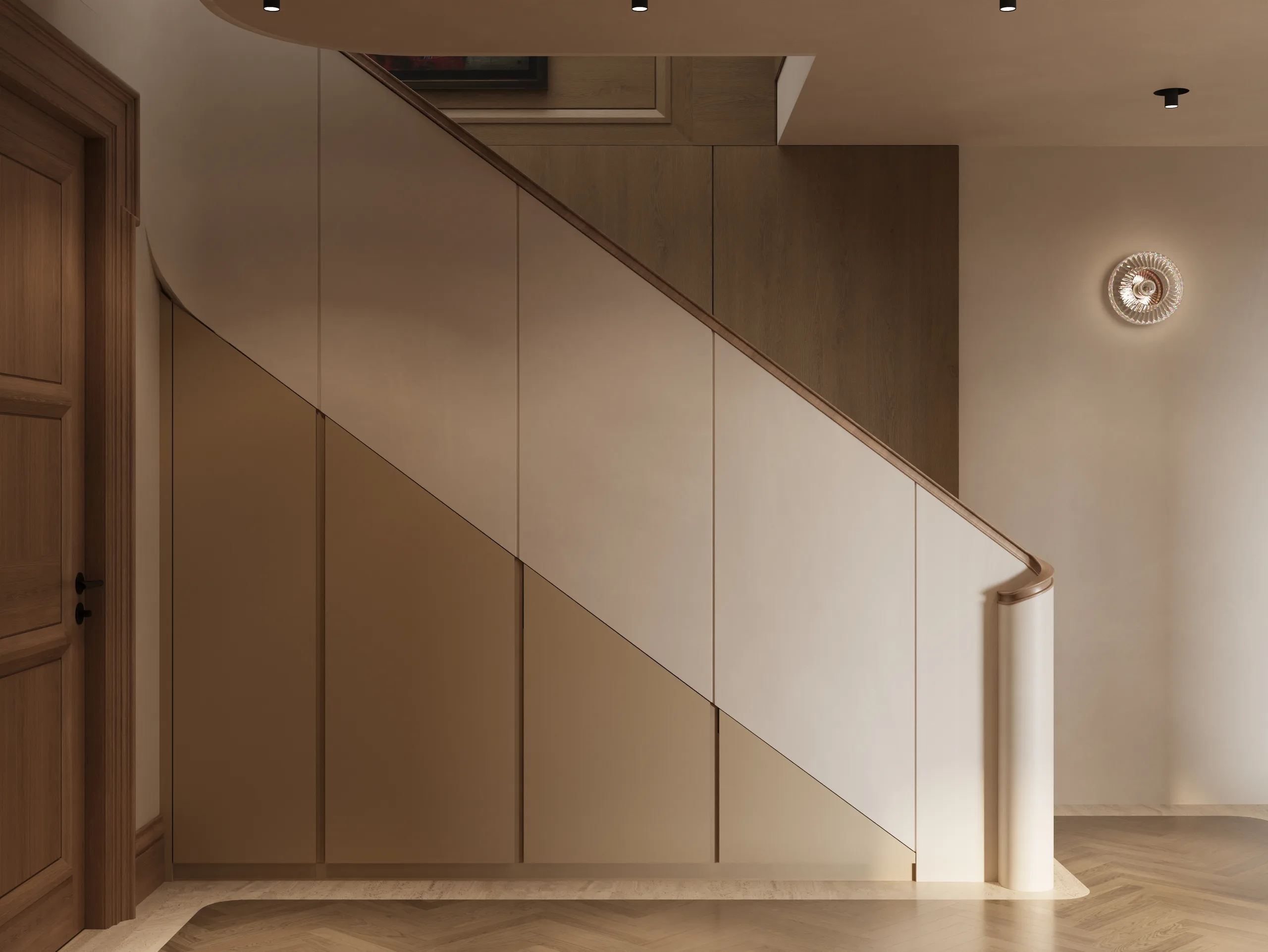 Handleless understairs storage joinery with a curved oak handrail and a herringbone parquet floor.